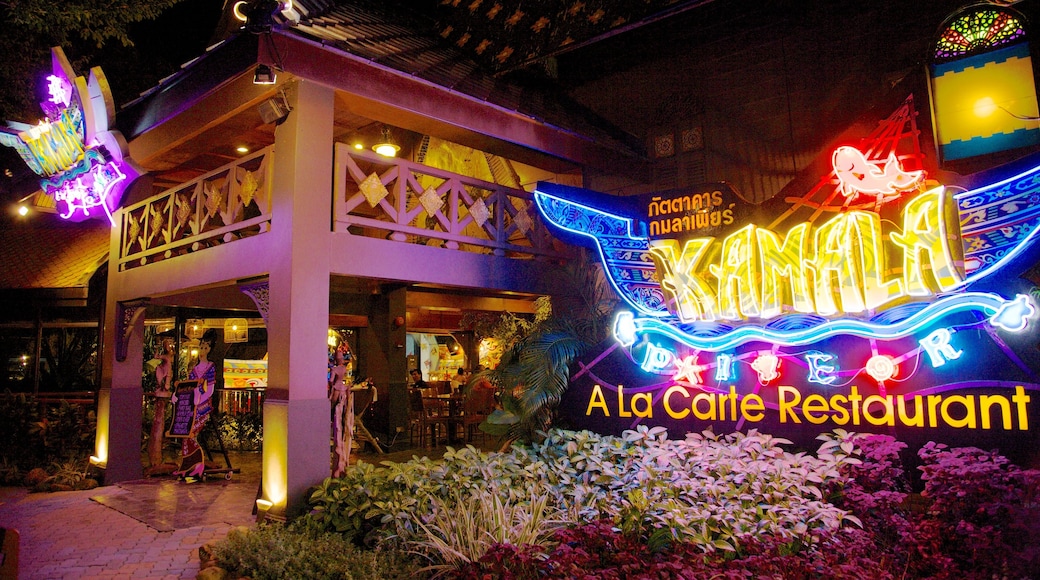 Phuket Fantasea featuring heritage architecture, signage and night scenes