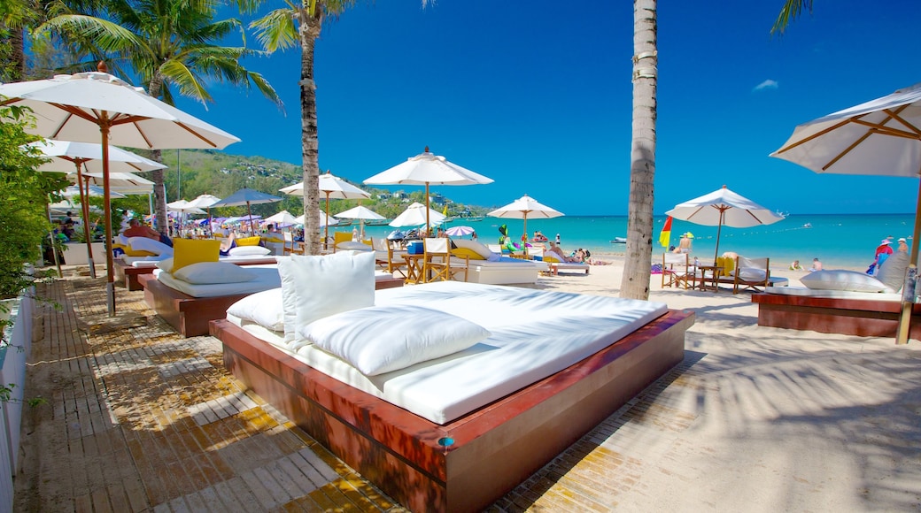 Kamala Beach which includes tropical scenes, a luxury hotel or resort and a sandy beach