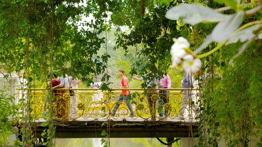 Vimanmek Palace which includes a lake or waterhole, heritage architecture and a garden
