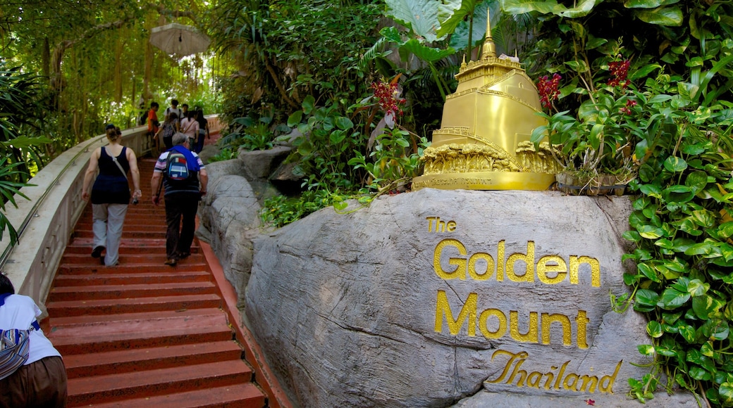 Wat Saket which includes rainforest, a park and signage