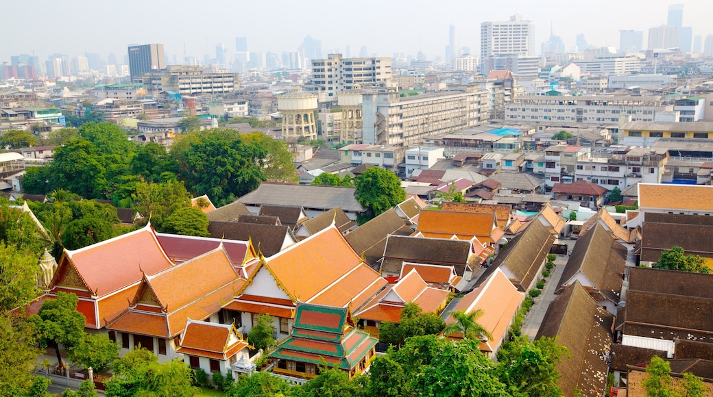 Wat Saket which includes a high rise building, a city and heritage architecture