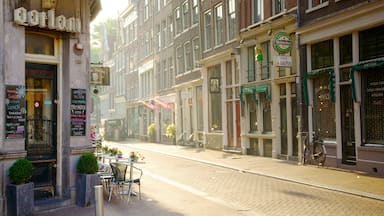 Muntplein featuring signage, a city and heritage architecture