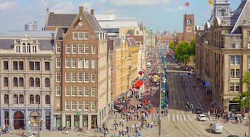 Dam Square which includes heritage architecture, street scenes and a city