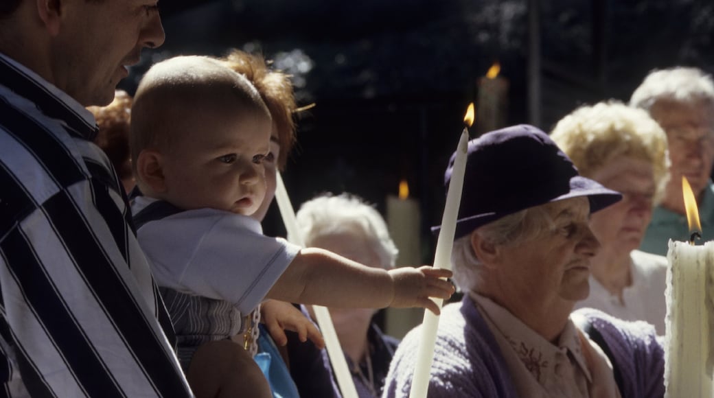 Lourdes as well as a small group of people