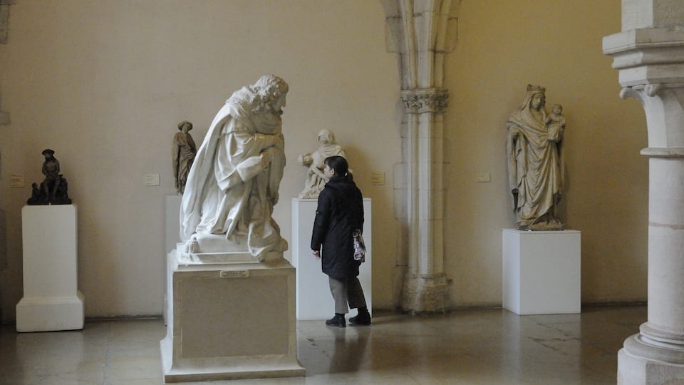 Dijon which includes a statue or sculpture, interior views and art