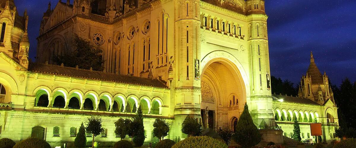 Lisieux which includes religious elements, night scenes and a church or cathedral