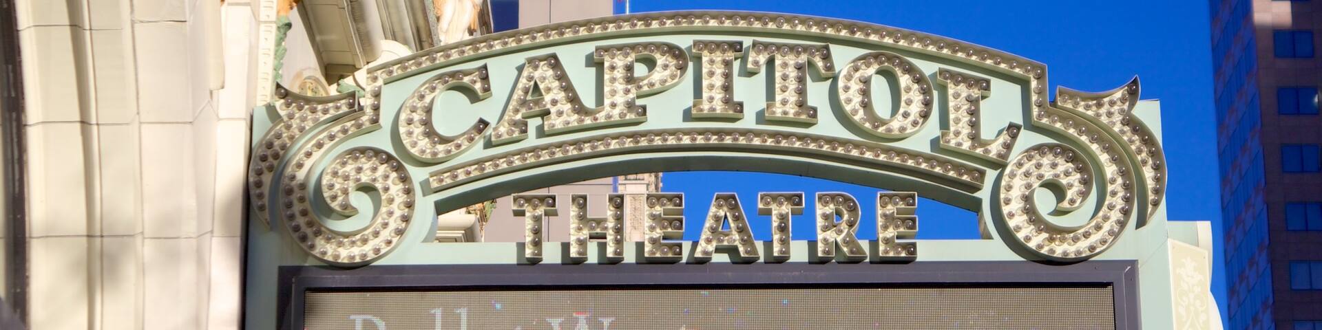 Capitol Theater featuring theatre scenes, performance art and a city