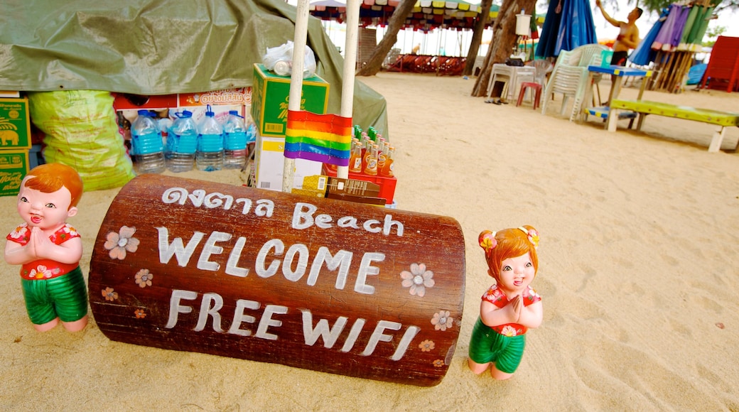 Dongtan Beach featuring signage and a sandy beach