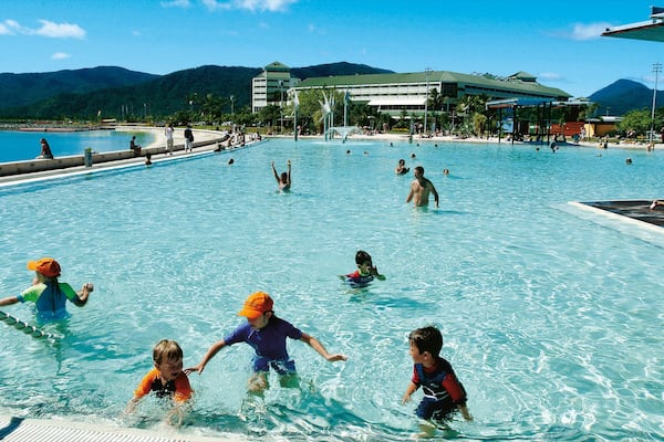 Cairns Esplanade which includes a luxury hotel or resort, a pool and swimming