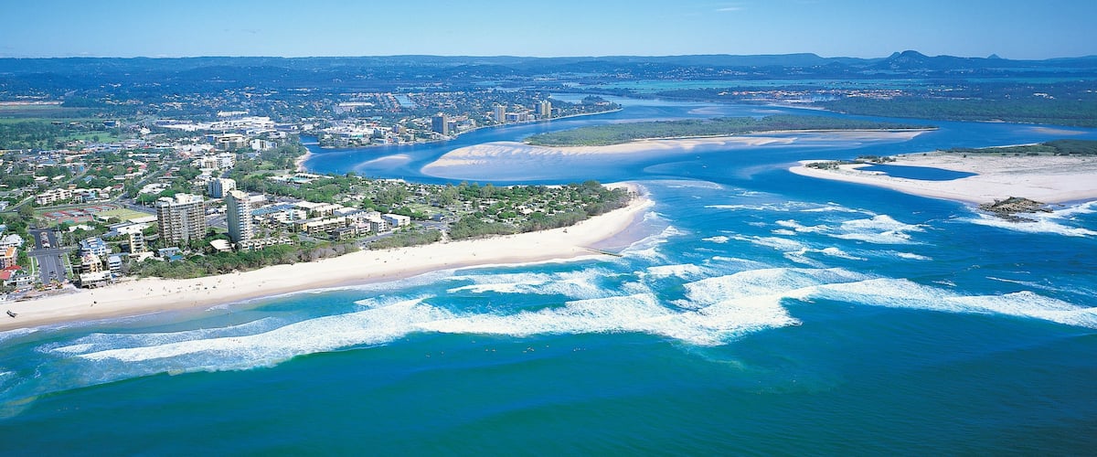 Maroochydore showing a coastal town, island views and a beach