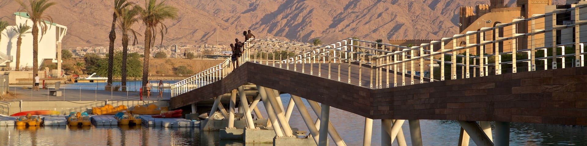 Eilat Marina which includes a bridge, mountains and a river or creek