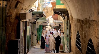 Jerusalem featuring street scenes as well as a small group of people