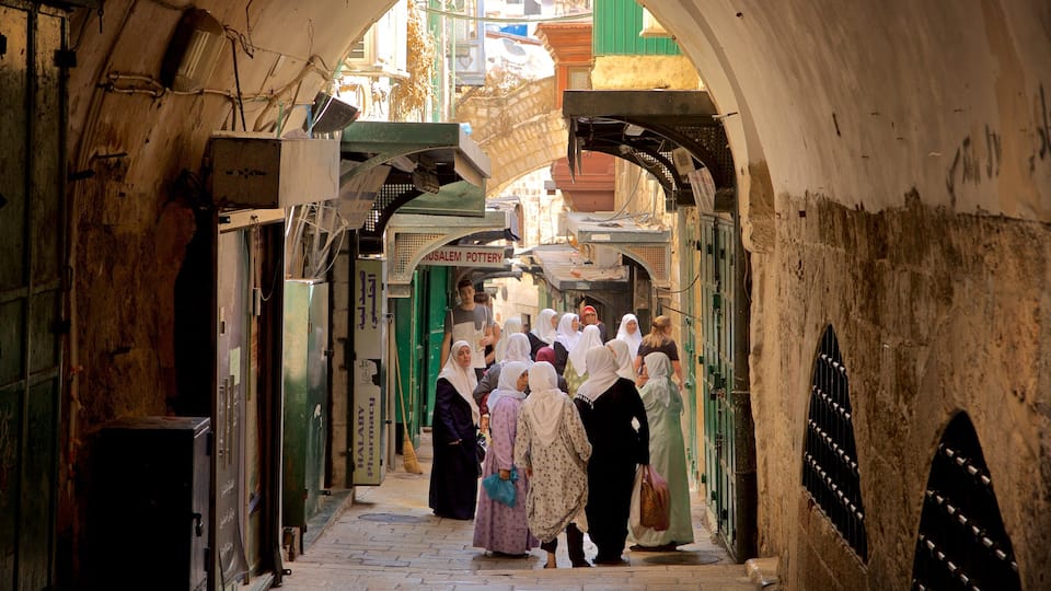 Jerusalem featuring street scenes as well as a small group of people
