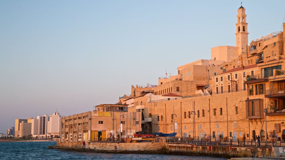 Jaffa Port showing a river or creek, a sunset and a city