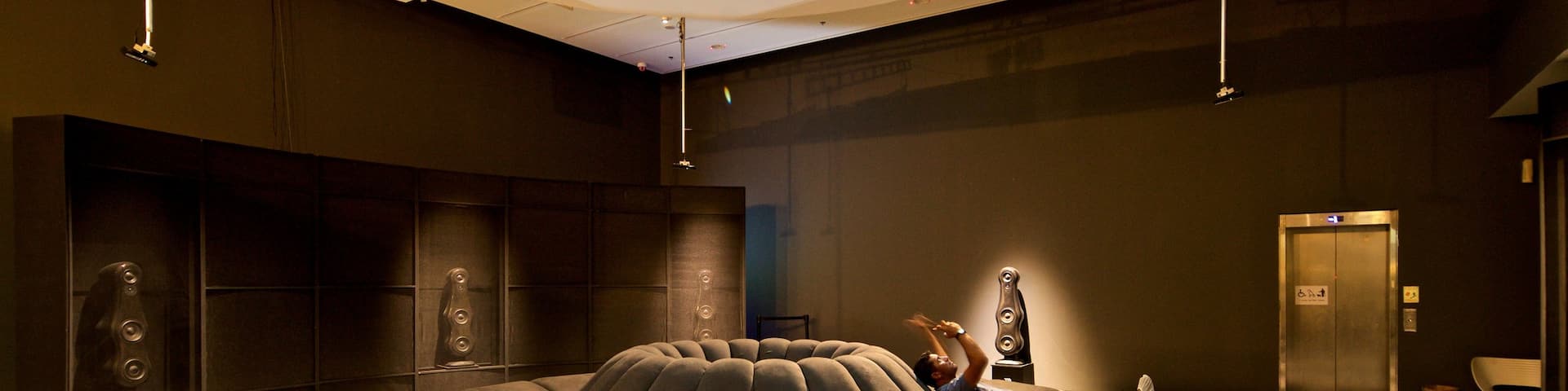 Design Museum Holon featuring interior views as well as an individual male