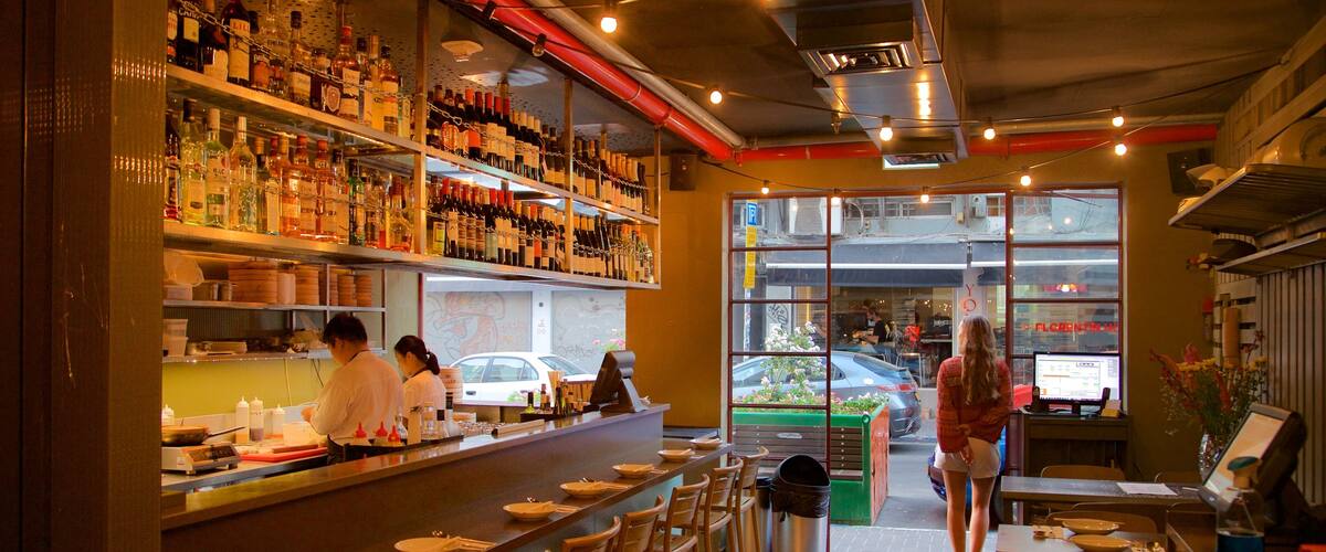 Florentin featuring interior views and a bar as well as a small group of people