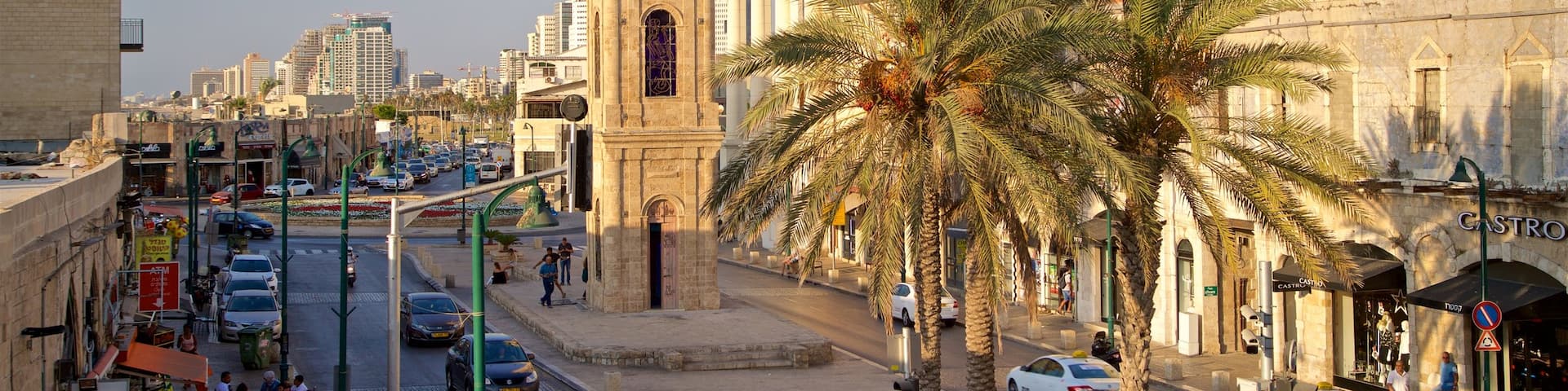 Jaffa Clock Tower which includes heritage architecture, a city and a sunset