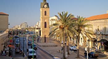 Jaffa Clock Tower which includes heritage architecture, a city and a sunset