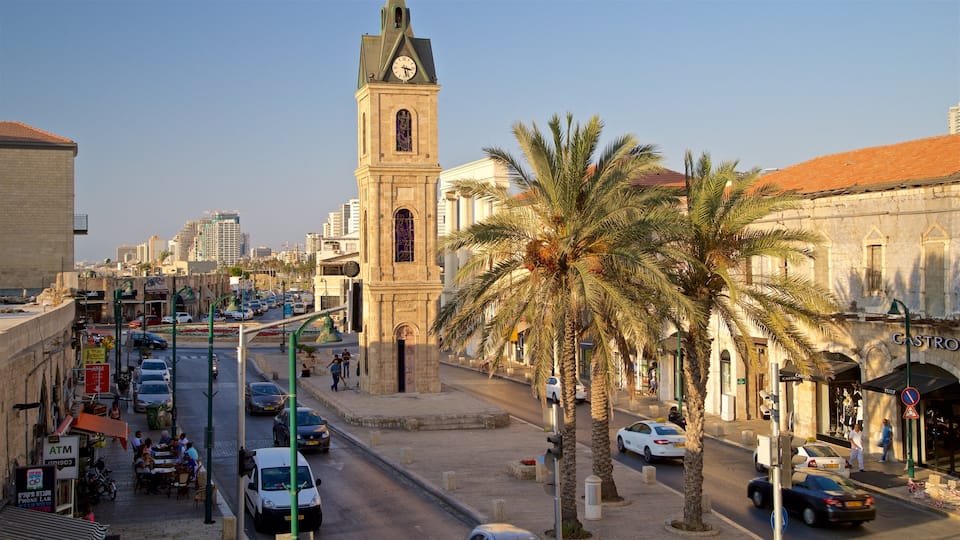 Jaffa Clock Tower which includes heritage architecture, a city and a sunset