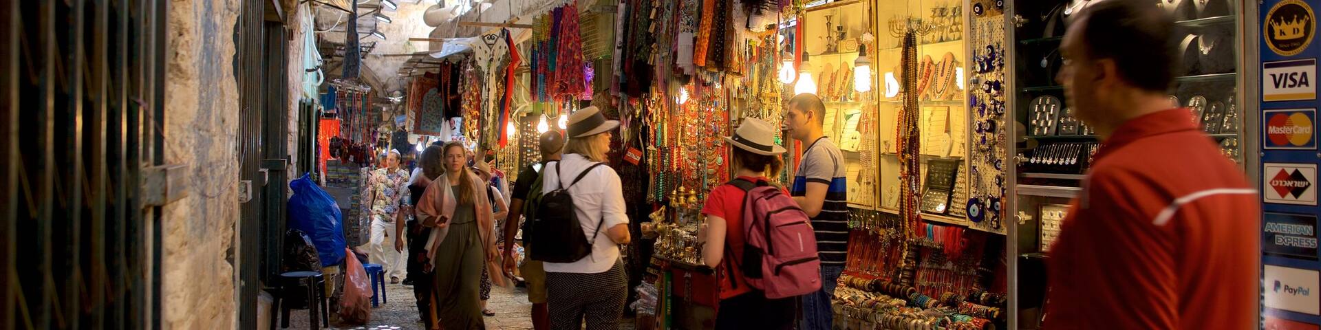 Mahane Yehuda Market featuring street scenes and markets as well as a small group of people