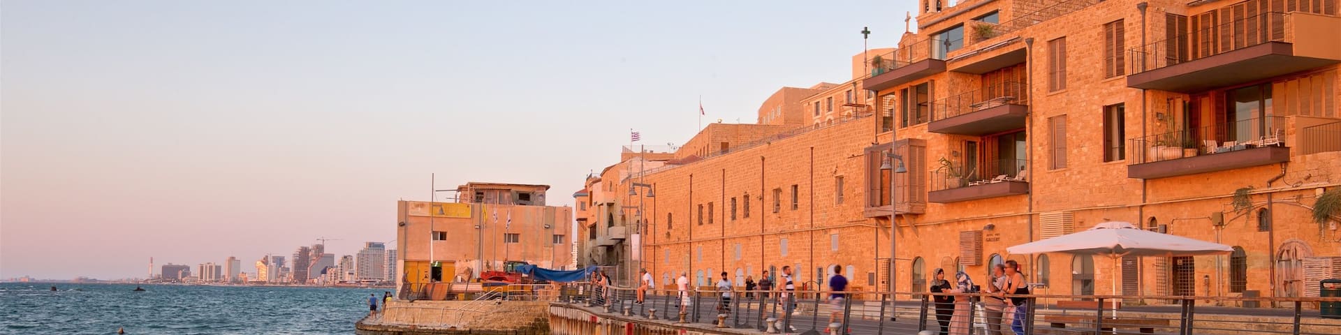 Jaffa Port showing a coastal town, general coastal views and a sunset