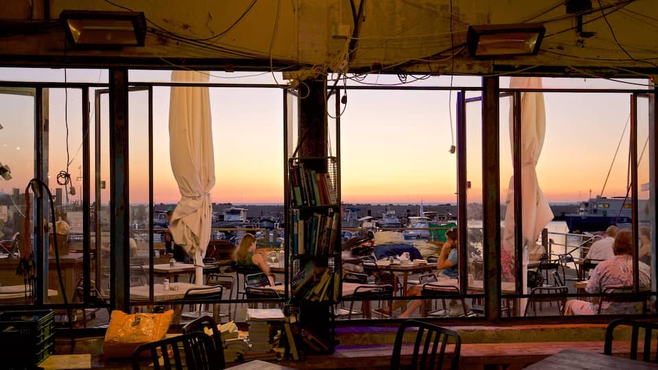 Jaffa Port which includes a sunset, dining out and interior views