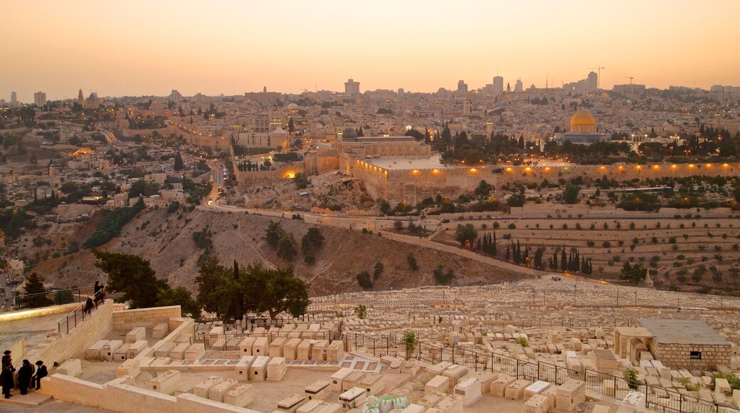 Mount of Olives which includes landscape views, a city and a sunset