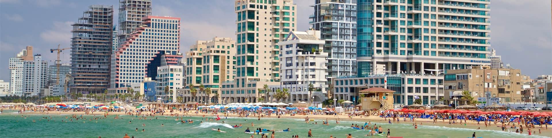 Tel Aviv featuring a coastal town, swimming and general coastal views