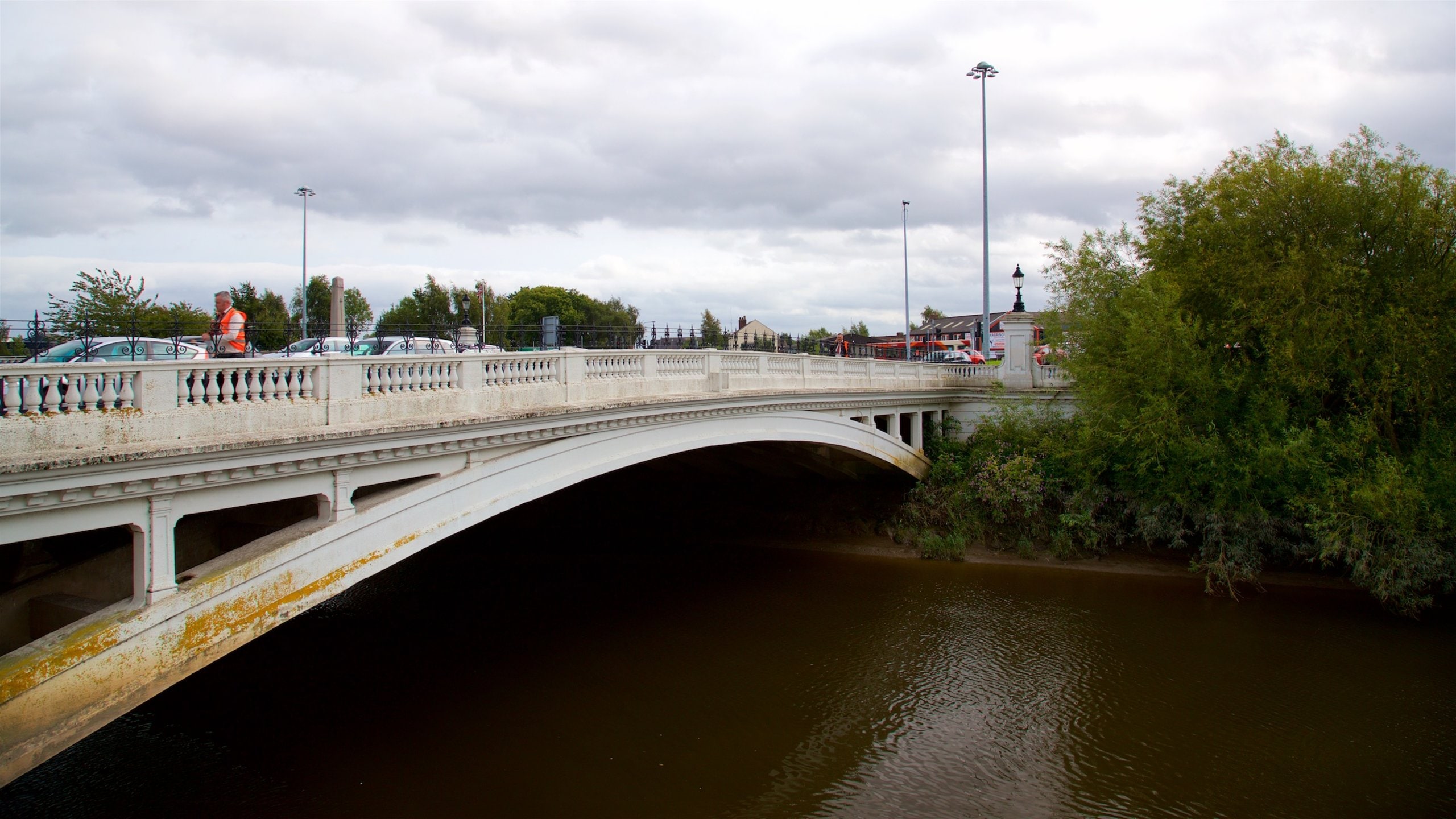 Warrington featuring a river or creek and a bridge