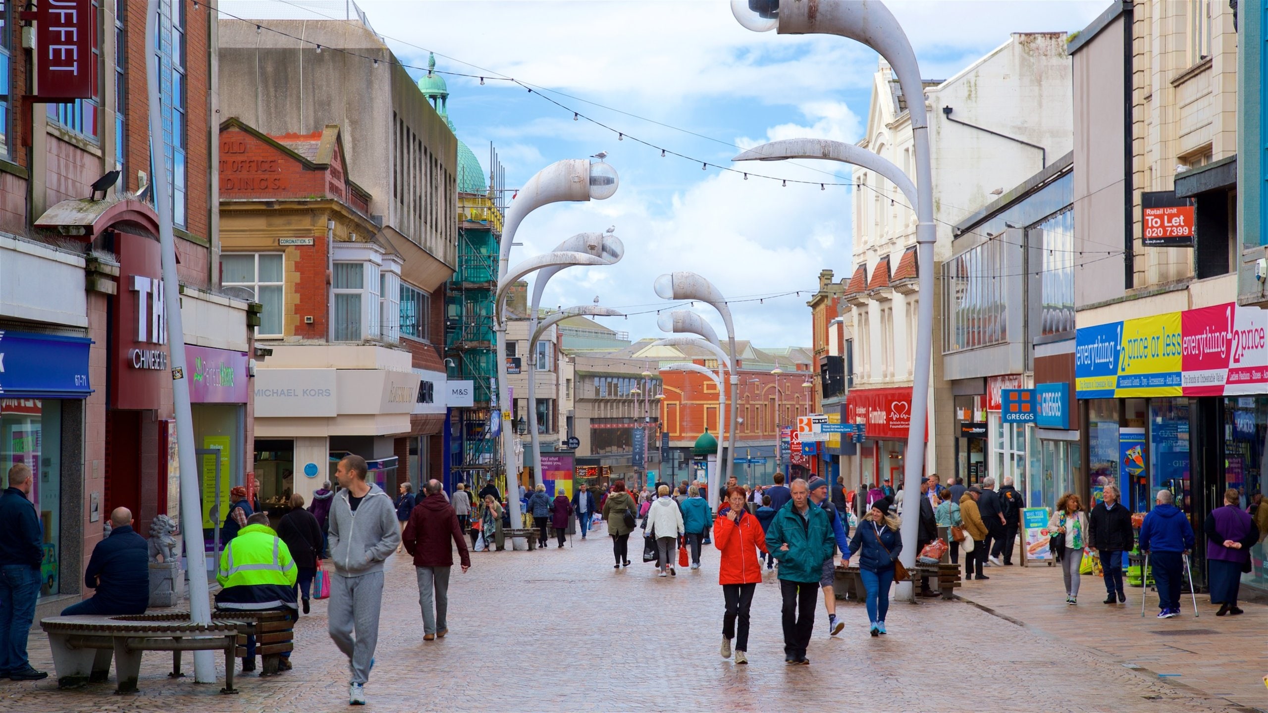 Blackpool which includes a city and street scenes as well as a large group of people