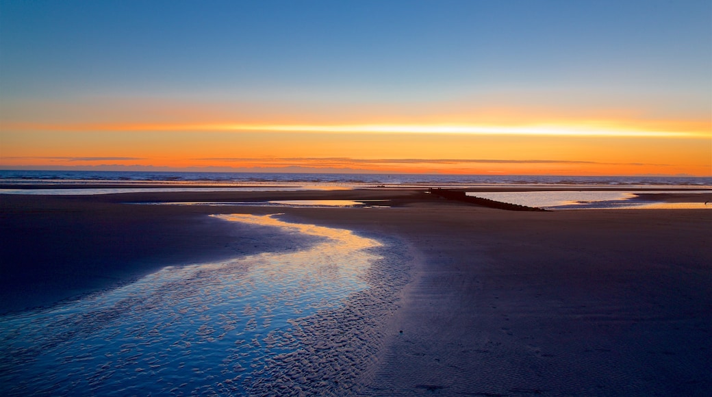 Central Beach which includes a sunset, a beach and general coastal views