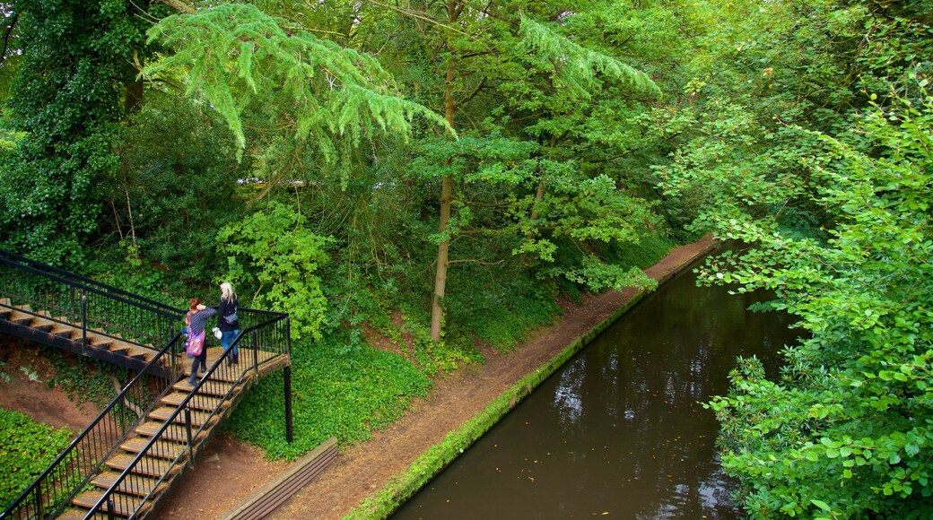 Warrington showing a park and a river or creek as well as a couple