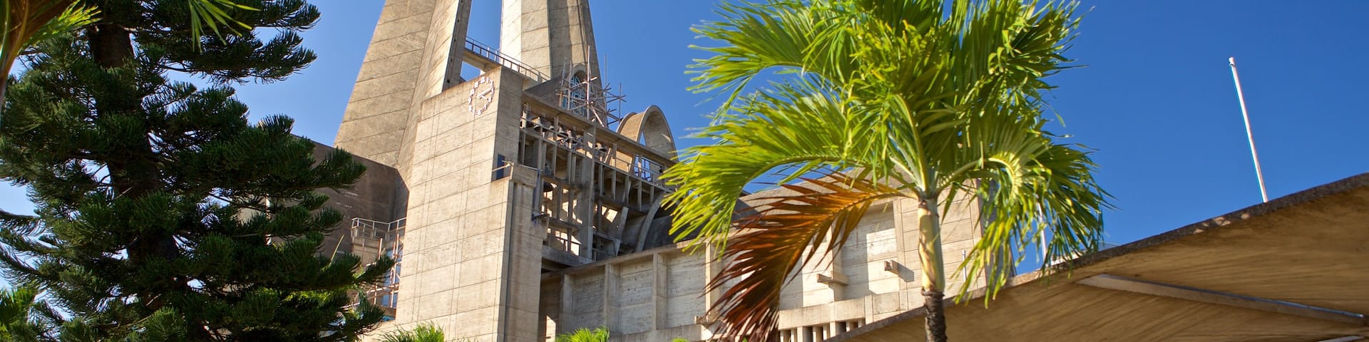 La Altagracia Cathedral showing modern architecture as well as a couple