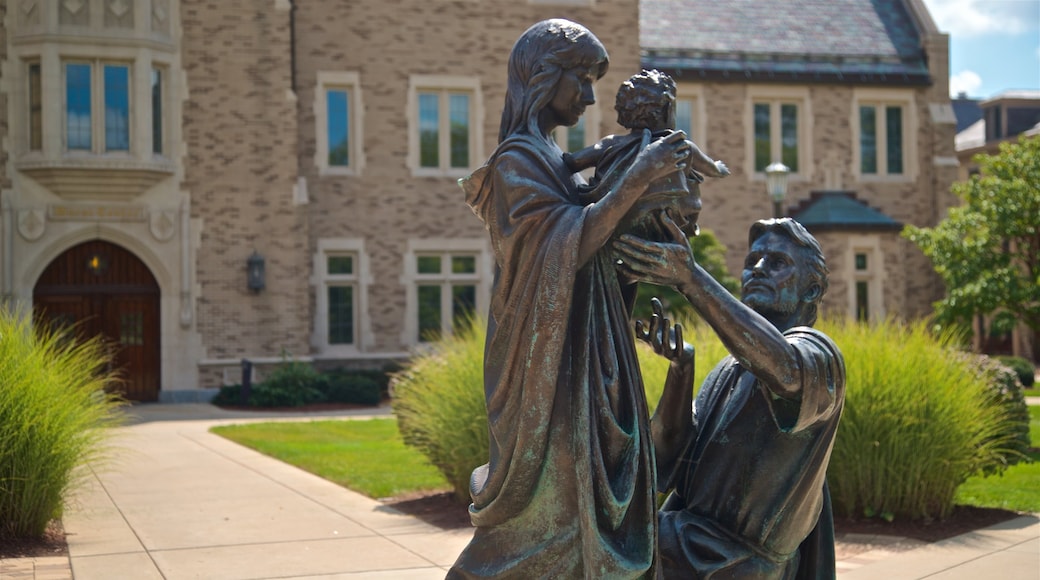 Basilica of the Sacred Heart featuring a statue or sculpture and a garden