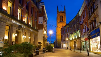 Derby Cathedral which includes heritage architecture, a city and night scenes