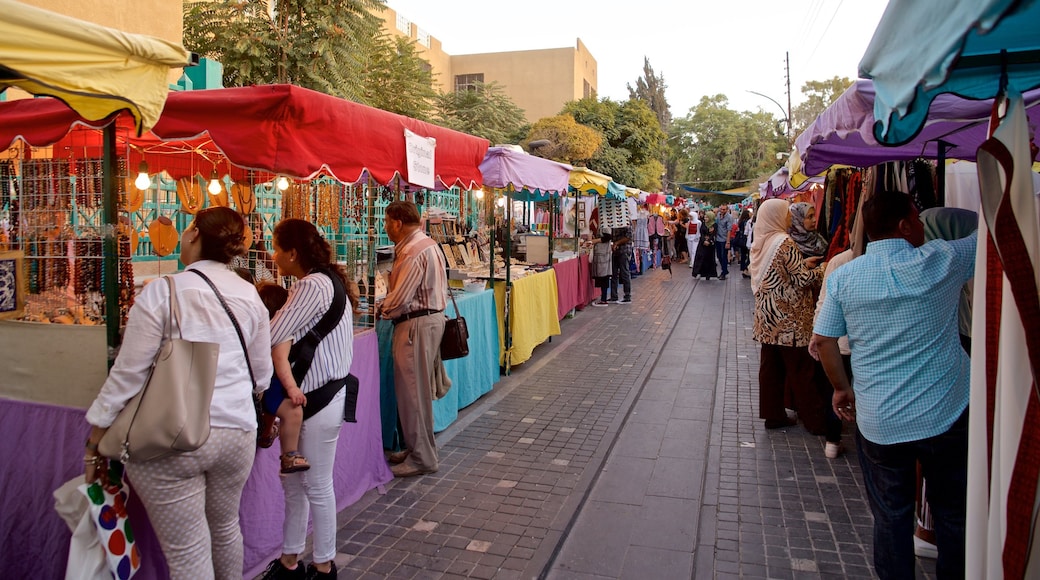 Souk Jara showing markets as well as a small group of people