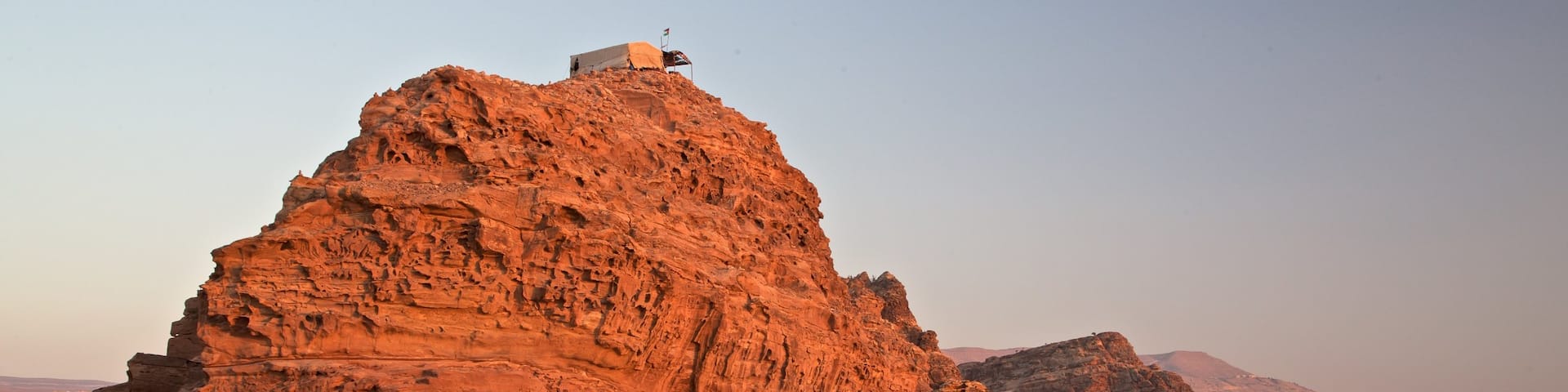 Petra which includes landscape views, a sunset and a gorge or canyon