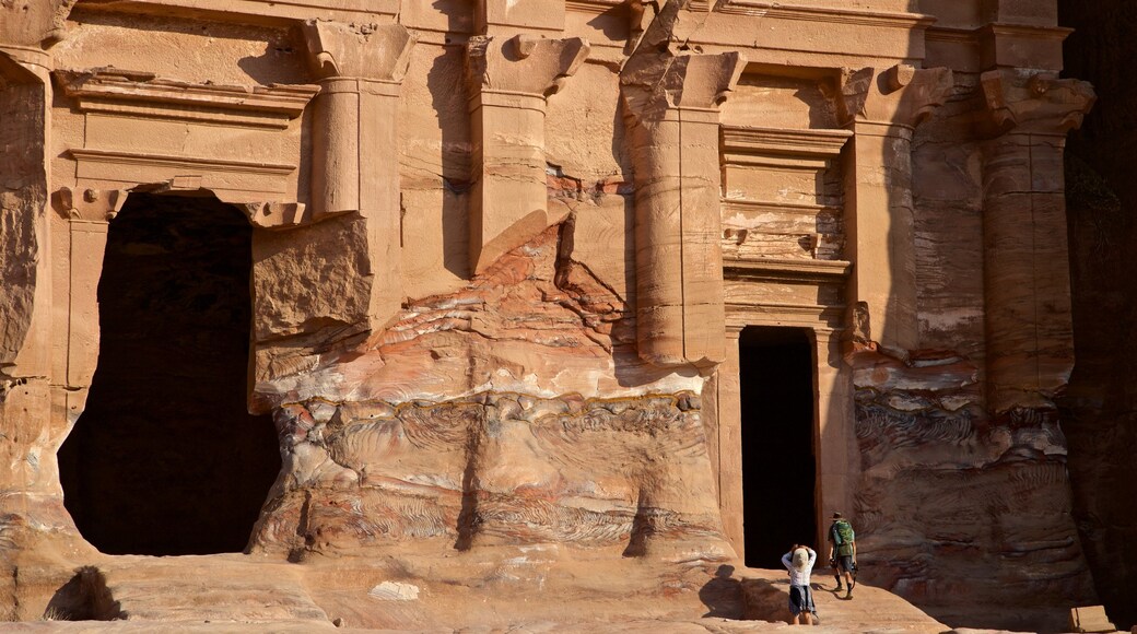 Wadi Musa showing building ruins and heritage architecture as well as a small group of people