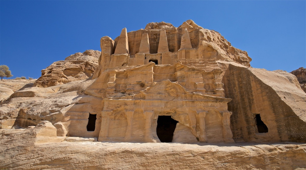 Obelisk Tomb featuring heritage architecture, a gorge or canyon and a ruin