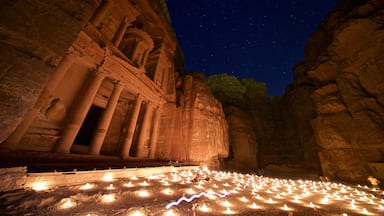 Wadi Musa which includes heritage architecture, a gorge or canyon and night scenes