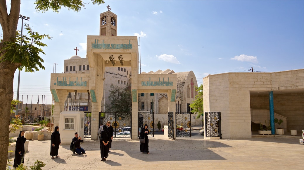 Coptic Orthodox Church featuring a church or cathedral as well as a small group of people