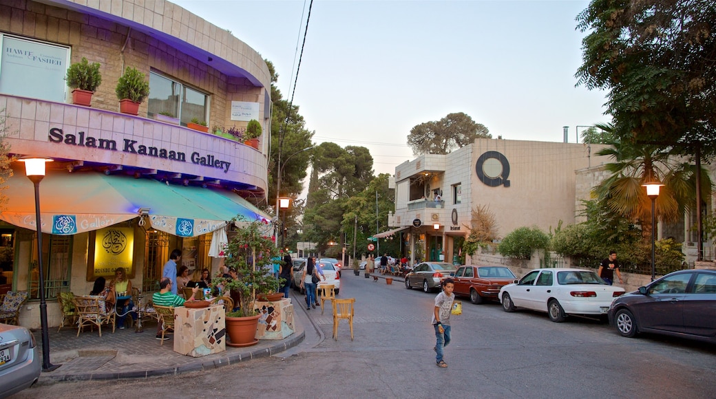 Rainbow Street que incluye imágenes de calles y una pequeña ciudad o aldea y también un niño