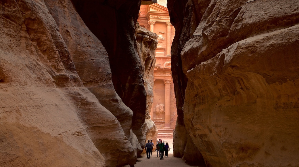 Wadi Musa showing a gorge or canyon as well as a small group of people