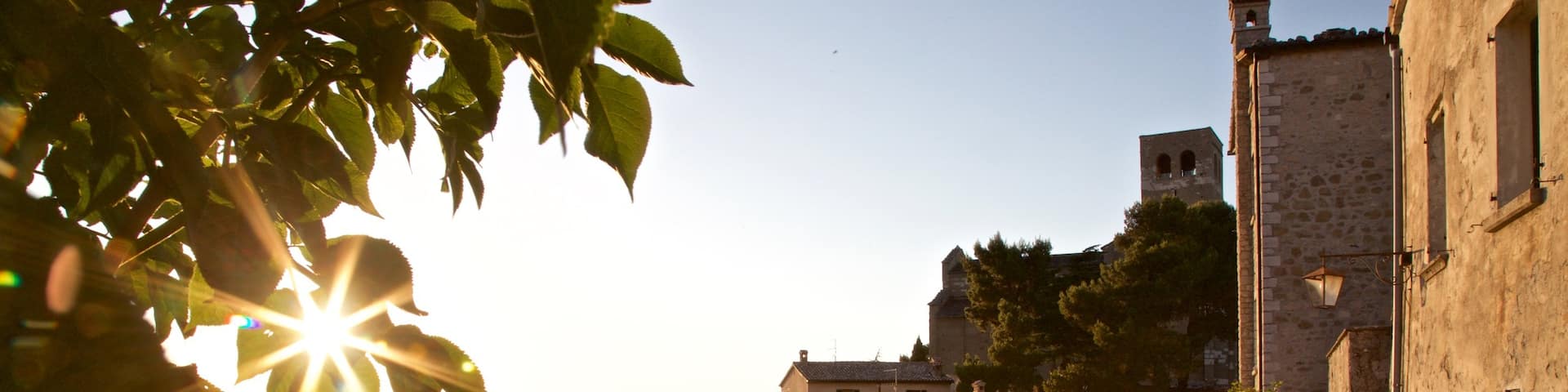 San Leo which includes a sunset and a small town or village