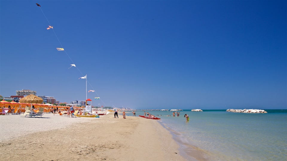 Torre Pedrera featuring a sandy beach, general coastal views and swimming