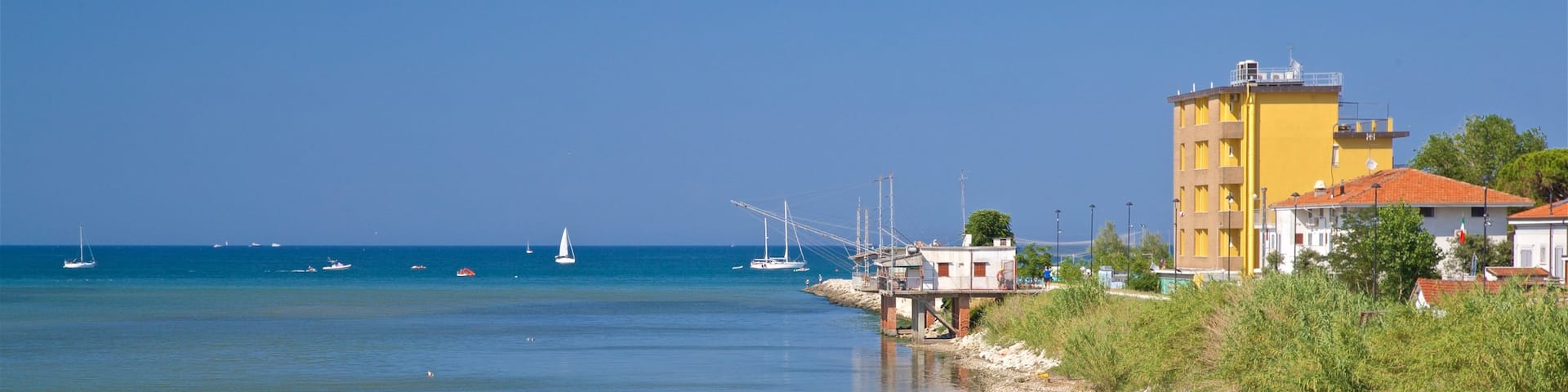 Rivabella showing general coastal views and swimming as well as a couple