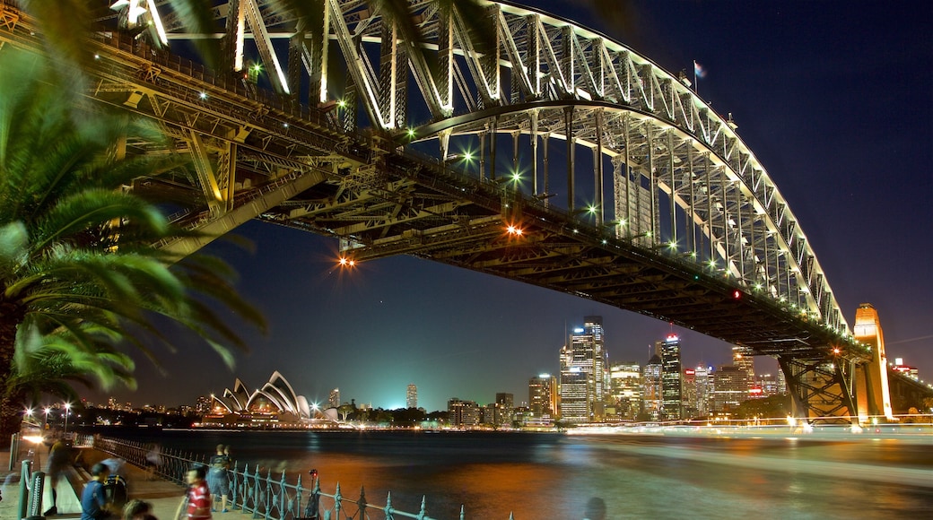 Sydney Harbour Bridge showing night scenes, a river or creek and a city