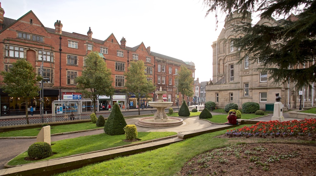 Wolverhampton which includes a fountain, heritage architecture and flowers