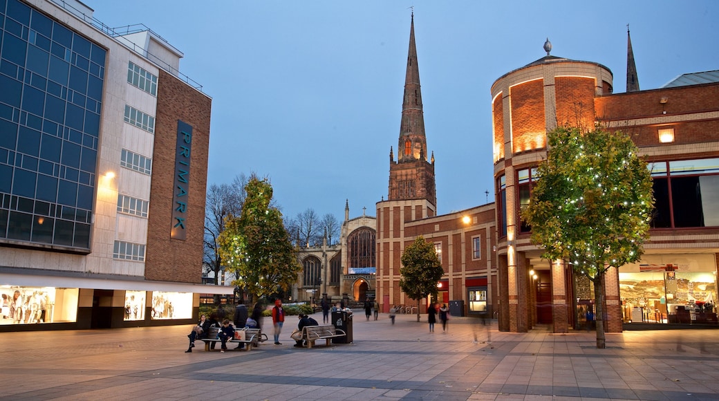 Coventry showing a square or plaza, a church or cathedral and night scenes