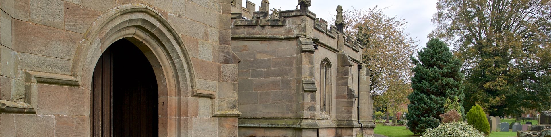 St. Bartholomews Church featuring a cemetery, a church or cathedral and heritage architecture
